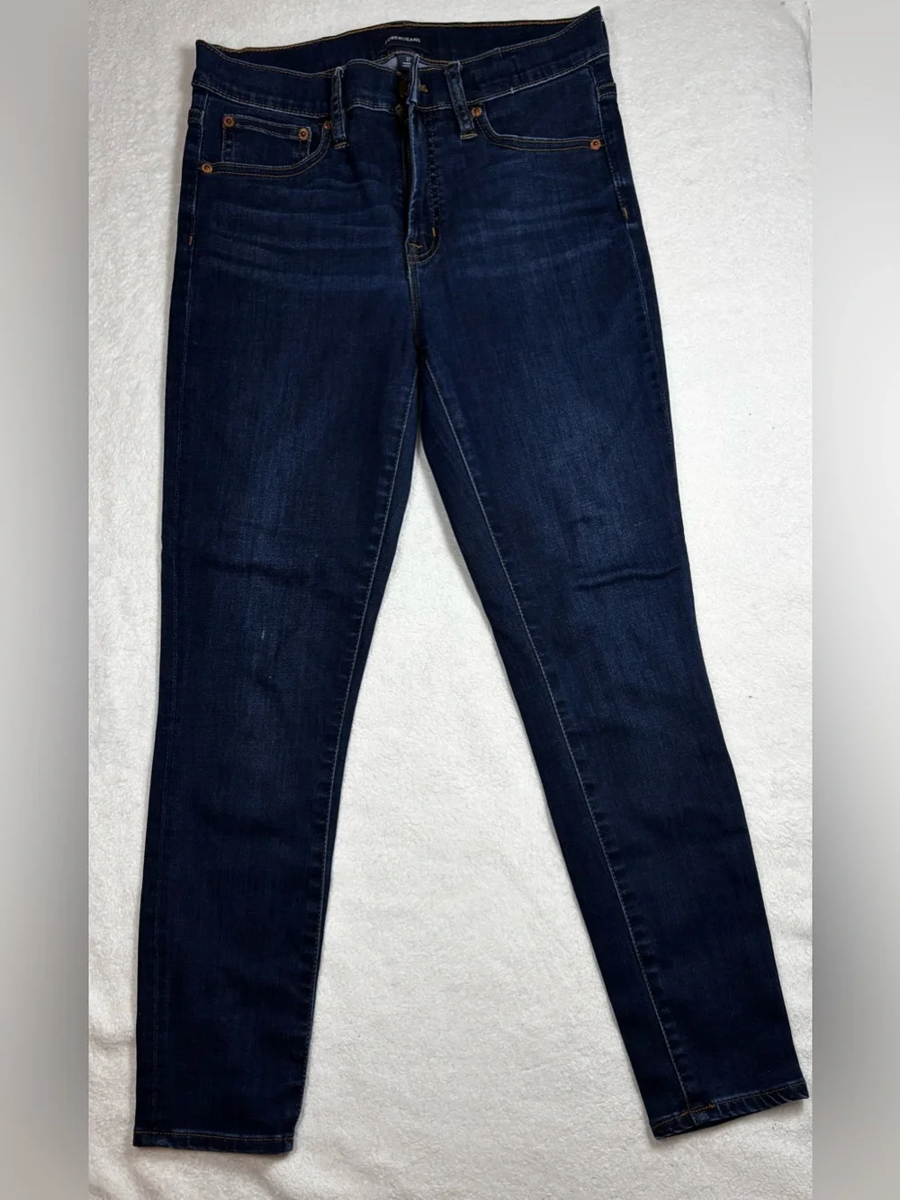 J.Crew jeans, Women’s high‑rise skinny size 27, dark wash, stretchy and sleek.